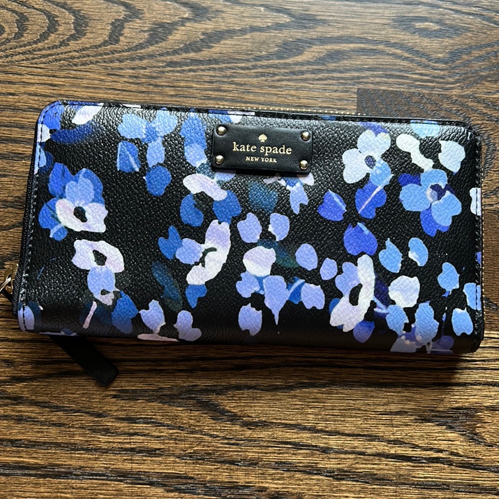 Kate Spade wallet. Navy faux leather with purple and blue flowers.